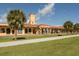 Historic train station with Mediterranean architecture surrounded by lush green landscaping at 1572 Jasper Ct, Venice, FL 34292