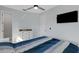 Bedroom featuring a TV, bed, ceiling fan, neutral paint, and closet at 1596 Landfall Dr, Nokomis, FL 34275
