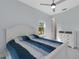Bedroom featuring a bed, dresser, ceiling fan, and natural light from the window at 1596 Landfall Dr, Nokomis, FL 34275