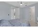 Bedroom featuring an open closet door, ceiling fan, and neutral paint at 1596 Landfall Dr, Nokomis, FL 34275
