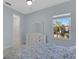 Light-filled bedroom featuring a dresser, window, and neutral decor at 1596 Landfall Dr, Nokomis, FL 34275