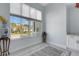 Bright bonus room with large windows providing a view of the neighborhood at 1596 Landfall Dr, Nokomis, FL 34275