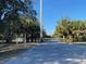 Gated community entrance surrounded by mature trees and palms at 1596 Landfall Dr, Nokomis, FL 34275