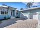 Charming one-story home featuring a two car garage, beautiful brick driveway, and a bright blue paint scheme at 1596 Landfall Dr, Nokomis, FL 34275