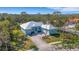 Stunning home featuring metal roofing, lush landscaping, and convenient garage parking, set in a serene location at 1596 Landfall Dr, Nokomis, FL 34275