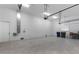 Large garage featuring tiled flooring, high ceilings, and ample space for storage and vehicles at 1596 Landfall Dr, Nokomis, FL 34275