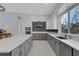 Kitchen with large island, stainless appliances and view to the exterior at 1596 Landfall Dr, Nokomis, FL 34275