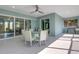 Bright screened lanai showcases dining area and a gas grill/sink, offering versatile space for entertainment at 1596 Landfall Dr, Nokomis, FL 34275