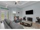 Inviting living room showcasing plush seating, a ceiling fan, and plenty of natural light at 1596 Landfall Dr, Nokomis, FL 34275