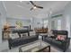 Spacious living area open to dining and kitchen, featuring modern furnishings and decor at 1596 Landfall Dr, Nokomis, FL 34275
