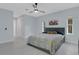 Spacious bedroom with light-colored walls, a ceiling fan, and bright natural light at 1596 Landfall Dr, Nokomis, FL 34275