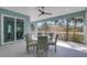 Screened in porch with ceiling fan and outdoor seating at 1596 Landfall Dr, Nokomis, FL 34275