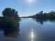 Scenic water view featuring sparkling water and lush greenery at 1596 Landfall Dr, Nokomis, FL 34275