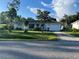 Inviting single-story home featuring well-kept lawn, mature trees, and a convenient attached garage at 181 Stanford Rd, Venice, FL 34293