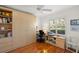 Bedroom featuring built in closets and desk area, with a large window providing natural light at 1904 Canary Island St, Venice, FL 34292