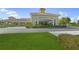 Front exterior view of the Venice Community Center, showcasing the lush landscaping and a well maintained facade at 1904 Canary Island St, Venice, FL 34292