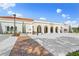 Beautiful view of the exterior of a modern library with red brick sidewalk and manicured landscaping under a sunny sky at 1904 Canary Island St, Venice, FL 34292