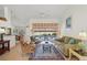 Comfortable living room with sliding glass doors to the pool area, and neutral decor at 1904 Canary Island St, Venice, FL 34292