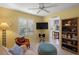 Bright living room with yellow walls, comfortable seating, and a modern TV setup, perfect for relaxation at 1904 Canary Island St, Venice, FL 34292