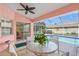 Patio featuring an outdoor dining area with a view of the pool, perfect for enjoying the outdoors at 1904 Canary Island St, Venice, FL 34292