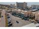 An aerial view shows the building's proximity to the beach and ample parking spaces for residents and guests at 200 The Esplanade N # B10, Venice, FL 34285