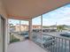 Relax on this screened balcony with a view of the parking and surrounding buildings at 200 The Esplanade N # B10, Venice, FL 34285