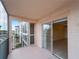 This screened balcony offers a peaceful retreat with sliding glass doors into the living area at 200 The Esplanade N # B10, Venice, FL 34285