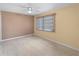 A bedroom with wood floors, neutral walls, a ceiling fan, and window blinds at 200 The Esplanade N # B10, Venice, FL 34285