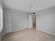 Spacious bedroom features modern ceiling fan and closet with folding doors at 200 The Esplanade N # B10, Venice, FL 34285