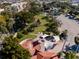 Overhead view of a neighborhood park featuring a splash pad, seating, and pedestrian walkways at 200 The Esplanade N # B10, Venice, FL 34285