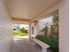 Welcoming entrance area with lush greenery and a comfortable seating area at 200 The Esplanade N # B10, Venice, FL 34285