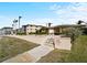 Well-maintained condo exterior, with walking paths and manicured landscaping at 200 The Esplanade N # B10, Venice, FL 34285