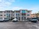 Charming building exterior featuring well-maintained grounds and convenient parking at 200 The Esplanade N # B10, Venice, FL 34285