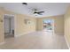 A living room featuring wood floors, a ceiling fan, with sliding doors to a screened lanai at 200 The Esplanade N # B10, Venice, FL 34285