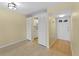 Open floorplan living room featuring wood floors and neutral-colored walls and adjacent kitchen at 200 The Esplanade N # B10, Venice, FL 34285