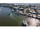 Aerial view of a marina with boats docked along the piers, surrounded by trees and buildings at 200 The Esplanade N # B10, Venice, FL 34285