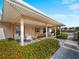 Charming outdoor porch with seating, perfect for relaxing and enjoying the views at 200 The Esplanade N # B10, Venice, FL 34285