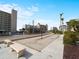 Outdoor shuffleboard courts and benches in a well maintained community space at 200 The Esplanade N # B10, Venice, FL 34285