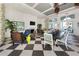 Elegant clubhouse interior with a fireplace, ample seating, and scenic views at 26825 Weiskopf Dr, Englewood, FL 34223