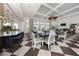 Spacious clubhouse with checkered flooring and many seating options for residents to relax and enjoy at 26825 Weiskopf Dr, Englewood, FL 34223