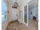 Welcoming entryway featuring stylish decor and a view into a bright, airy office space at 26825 Weiskopf Dr, Englewood, FL 34223