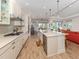 Spacious kitchen with modern appliances, an expansive island, and an open layout at 26825 Weiskopf Dr, Englewood, FL 34223
