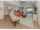 Well-lit living room with contemporary furnishings seamlessly connected to the kitchen at 26825 Weiskopf Dr, Englewood, FL 34223