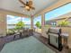 Cozy screened-in patio with dining area, a barbecue grill and beautiful water views at 26825 Weiskopf Dr, Englewood, FL 34223