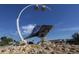 Unique seashell sculpture is a landmark with artistic flair set against a vibrant blue sky at 26825 Weiskopf Dr, Englewood, FL 34223