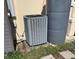 Exterior showing the home's AC unit and water storage tank at 2863 Twinkle Ave, North Port, FL 34286