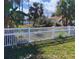 Backyard featuring a white picket fence providing a secure and private outdoor space at 2863 Twinkle Ave, North Port, FL 34286