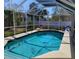 Screened-in pool area with a refreshing blue pool, perfect for relaxing and entertaining at 2863 Twinkle Ave, North Port, FL 34286