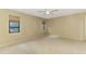 Spacious bedroom features neutral walls, carpet, and a modern ceiling fan at 3203 Meadow Run Dr, Venice, FL 34293