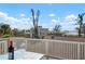 Relaxing outdoor balcony setting with a bottle of wine, glasses, and ocean views at 397 Flamingo Dr, Venice, FL 34285